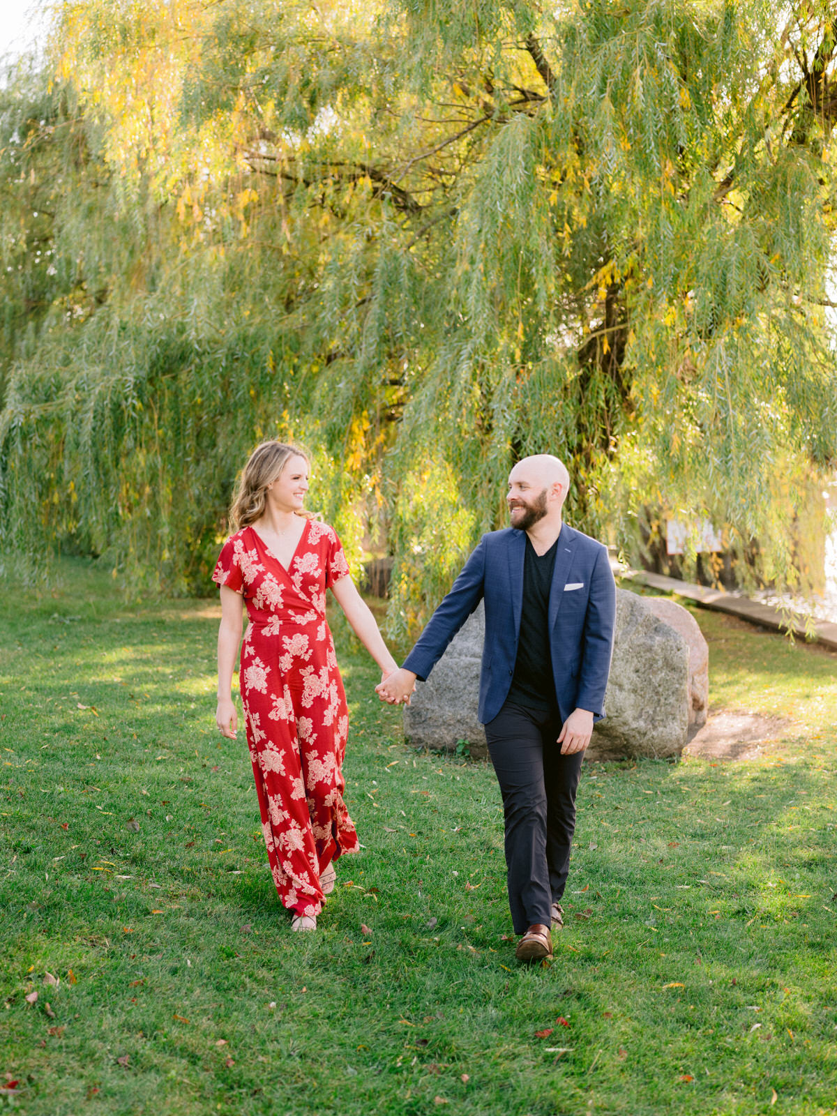 ping tom memorial park engagement photos couple walking in front of weeping willow tree